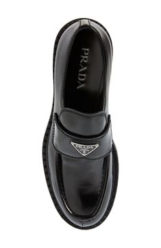 Prada's iconic triangular logo shines on a brushed-leather loafer tastefully updated with a ridged welt resembling tiny chocolate bars. Leather upper and lining/rubber sole Made in Italy Men's Designer Shoes Luxury Glossy Loafers For Formal Occasions, Luxury Glossy Finish Loafers For Formal Occasions, Luxury Glossy Finish Loafers For Formal Events, Luxury Glossy Finish Formal Loafers, Classic Glossy Business Loafers, Classic Glossy Finish Business Loafers, Business Leather Loafers With Glossy Finish, Glossy Leather Loafers For Business, Classic Leather Loafers With Glossy Finish