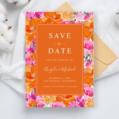 an orange and pink floral save the date card