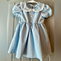 Never Worn Light Blue Ruffled Dress For Playdate, Blue Ruffled Dress For Playdate, Fitted Blue Dress For Baptism, Blue Fitted Dress For Playdate, Light Blue Baptism Dress For Spring, Blue Lace Trim Dress For Baptism, Light Blue Spring Baptism Dress, Blue Spring Dress For Play, Blue Short Sleeve Dress For Play