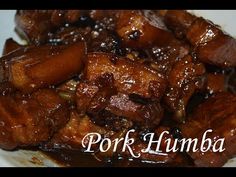 a close up of food on a plate with the words pork humba above it