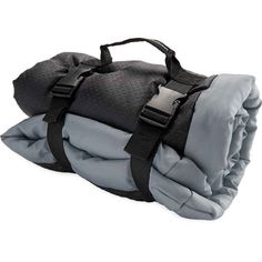 an image of a sleeping bag on top of it's back straps and zippers