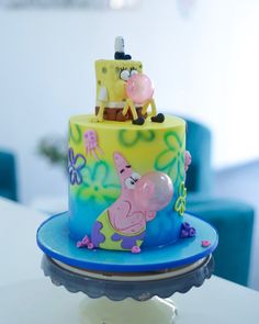 a peppa pig cake sitting on top of a table