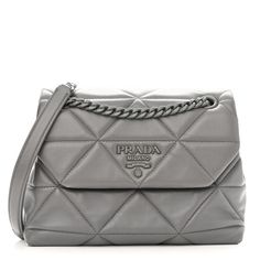 This is an authentic PRADA Nappa Stitched Small Spectrum Bag Marmo. This is a chic Prada handbag that is beautifully crafted of quilted Nappa leather in gray. The shoulder bag features chain shoulder straps and a crossover flap that opens to a gray jacquard partitioned fabric interior with a patch pocket. Prada Chain Bag, Prada Chain, Prada Handbag, Prada Nylon, Triangle Quilt, Prada Saffiano, Prada Handbags, Wallet Chain, Black Cross Body Bag