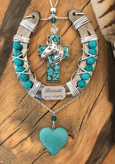 a necklace with a cross and turquoise beads