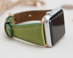 Full Grain Leather Green Slim Band for Apple Watch 1-6Material: Full grain leather. Our leathers are premium quality full grain leather and tested by international firms.Size: Medium (fits 150-190mm (5.9"-7.4") wrists.)Color of buckle will be same of adapter color.Customization: We can write names, dates, texts on straps. You may have this service from here: www.etsy.com/listing/643428565CUSTOMER SATISFACTION GUARANTEE: If you are not satisfied with our items within 30 days after you receive, pl Green Leather Modern Watch Accessories, Modern Green Leather Watch Accessories, Green Leather Watch Bands For Everyday Use, Apple Watch Blue, Apple Watch Cuff, Apple Watch Silver, Brown Apple, Apple Watch Fashion, Apple Band