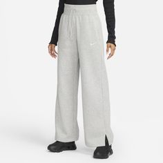 Rise up and transform your fleece wardrobe with strong cozy vibes. The extra-long, wide leg and hem vents of these Phoenix Fleece pants let you show off your favorite shoes while taller ribbing at the waist and an exaggerated drawcord ensure your look is anything but basic. Benefits Smooth on the outside and cozy on the inside, brushed fleece is our go-to sweatshirt material for colder temperatures. Elongated ribbing at the waist provides extra comfort and structure. Product Details Body: 80% co Nike Sportswear Phoenix Fleece, High Waisted Sweatpants, Fleece Pants Women, High Waisted Wide Leg Pants, Nike High, Wide Leg Sweatpants, Loungewear Luxury, Nike Sweatpants, Nike Leggings