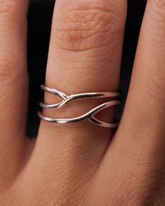 This is a smaller version of our popular Curved Wraparound ring! This ring makes a delicate and minimalist cocktail ring and is also great for everyday wear. This listing is for ONE SINGLE ring in STERLING SILVER. Made from THICK (1.5mm) metal wire.Available in a SMOOTH or HAMMERED finish. This ring is unique and is sure to turn some heads! To make this style, we wrap a length of wire and then securely solder it at two points. Because the metal is not wrapped over itself, like the original Wrapa Minimalist Cocktail, Infinity Art, Criss Cross Ring, Woven Ring, Single Ring, Stacking Ring Set, Spring Jewelry, Cross Ring, Large Ring