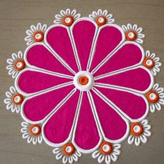 a pink and white flower with orange accents