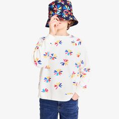 Spring has sprung—in the form of a super soft sweatshirt! Makes a great seasonal layer and features our new bright bloom print, which pretty much feels like a wearable kaleidoscope of joy and color. P.S. Comes in grown-up sizes, too! Fabric: 100% cotton French terry; pre-washed to minimize shrinkage. Feel: Super soft and comfortable, with a natural thickness that stands up to play. Playful Long Sleeve Sweatshirt For Spring, Playful Multicolor Long Sleeve Sweatshirt, Playful Multicolor Graphic Print Sweatshirt, Playful Multicolor Spring Sweatshirt, Playful White Sweatshirt For Fall, Playful Multicolor Winter Sweatshirt, Playful Crew Neck Sweatshirt For Spring, Colorful Playful Long Sleeve Tops, Spring Playful Patterned Tops