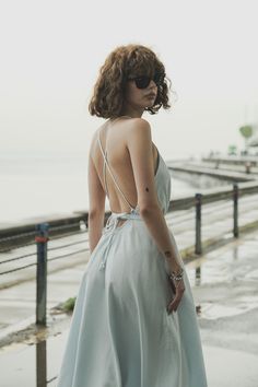 Our stylish, must-have version of the essential LBD (little ​beach dress), the Sage Maxi Dress Baby Blue is a flowing asymmetric dream that’s perfect for mid-summer events, beach days, and travel. The silhouette is inspired by the tranquil vibes of Tulum’s beaches and bustling energy of its town center. It features long straps you can wrap twice around the waist for an adjustable fit. Breathable fibers keep you cool as you lounge, explore, and indulge all summer long. Sage Maxi Dress, Dress Baby Blue, Mid Summer, Town Center, Summer Events, Beach Days, Beach Dress, Tulum, Asymmetric Hem