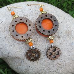 Hand Crafted Tangerine With Bronze-Tone Gears Lightweight Steampunk Dangle Statement Pierced Earrings New With Tags - Designed & Handmade By Me Alex 8 Essential Earrings For Anyone With Modern Victorian, Eclectic, Hippy, Flower Child, Boho, Gypsy Or Festival Tastes One Of A Kind Style To Elevate Your Mood & Outfit - Vintage Vibes With A Contemporary Twist Tangerine Orange Base With Antique Brass Tone Gear Overlay & Dangles Gold Tone Metal Findings Detail Amazingly Lightweight High Quality & Dura Unique Orange Metal Earrings, Handmade Orange Copper Earrings, Unique Orange Earrings For Festival, Orange Festival Earrings For Pierced Ears, Orange Metal Earrings, Orange Metal Pierced Earrings, Nickel-free Orange Earrings For Festival, Orange Pierced Metal Earrings, Victorian Eclectic