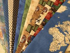 several different colored maps are laid out on top of each other, with the world map in the background