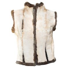 This irresistible Fall/Winter 1999 Gucci reversible calf fur and fur vest was designed by Tom Ford. This vest features tan calf hair on one side and natural-colored rabbit fur on the other. The vest has hook closures and two well-concealed pockets on the calf fur side. The perfect two-in-one, you can't go wrong with this Tom Ford for Gucci creation! Approximate measurements: Size - IT42 Bust: 30” Waist: 35” Shoulder to hem: 22” Tom Ford For Gucci, Gucci By Tom Ford, Rabbit Fur Vest, Gucci Coat, Gucci Brand, Versace Couture, Gucci Outfits, Archive Fashion, Tweed Coat