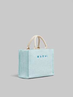 East-West small tote bag in raffia-effect fabric. Two sets of handles in cotton ribbon, short for hand carry, long for shoulder carry. Fabric Lining with zipped pocket. Palladium Hardware. Embroidered Marni logo on the front. Interior Branding, Cotton Ribbon, Small Tote Bag, Woven Tote Bag, Small Tote, East West, Blue Bags, Logo Embroidered, Blue Brown