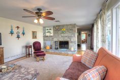 a living room filled with furniture and a fire place