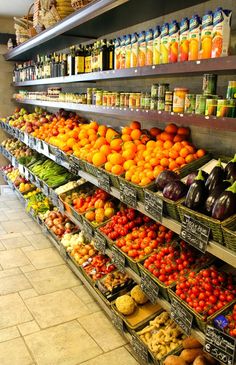 a grocery store filled with lots of fresh fruits and vegetables