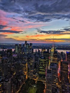 an aerial view of new york city at sunset