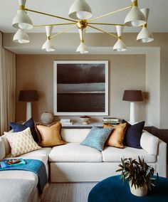 a living room filled with furniture and lamps