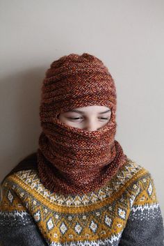 Experience the epitome of style and warmth with our meticulously handcrafted knitted unisex balaclava. Designed to adorn teens and adults, this balaclava is your perfect companion for fall and winter adventures. Made from the softest merino yarn in a rich rust brown hue, and featuring a stretchy rib pattern, this balaclava guarantees both comfort and elegance. Envision yourself stepping into the crisp fall air or braving the winter winds, all while cocooned in the luxury of this artisanal masterpiece. Crafted for versatility, this balaclava is as functional as it is fashionable. The stretchy rib pattern ensures a snug fit, offering protection from the elements without compromising on style. But this balaclava is more than just an accessory; it's a statement of quality and artistry. Each st Handmade Casual Balaclava Beanie, Handmade Balaclava For Winter, Knitted Balaclava Inspire Uplift ⭐, Warm One-size Hooded Balaclava, Hand-knitted Full-face Balaclava, One Size, Knitted Balaclava, Merino Wool Yarn, Winter Adventure, Winter Essentials