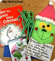 the grinch stole christmas book is next to other books on a wooden table with green string