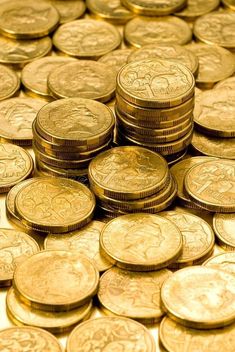 a pile of gold coins sitting on top of each other