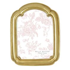 a gold frame with pink flowers on it