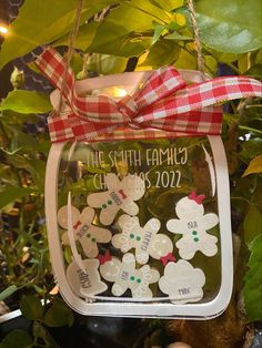 a glass jar filled with christmas decorations