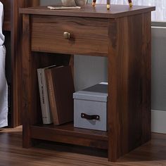 a night stand with an alarm clock on it