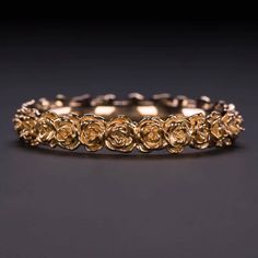 This beautiful and unique botanical stacking band features roses intricately rendered in 14k rose gold. Inspired by the boundless and surprising beauty of the natural world, these romantic beauties are gorgeous on their own or in a stack! The blushing warm of the rose gold is a pretty and apropos tribute to the flowers themselves. The ring is rendered in solid 14k rose gold, and the design continues all the way around the band. With its dreamy air of fairytale romance, this band would make an excellent wedding ring! This ring is made to order and requires additional handling time due to the full eternity design. Please allow 7 business days handling time. This unique botanical ring makes a beautiful wedding band, stacking band, or stand alone ring. It is an Ivy and Rose original design, so Rose Gold Stacking Rings, Gold Rose Ring, Elegant Floral Rings With Rose Details, Vintage 14k Rose Gold Flower Ring, Luxury Rose Gold Flower Ring With Rose Design, Rose Gold Floral Wedding Band, Nature-inspired Gold Flower Ring, Rose Gold Flower Ring, Botanical Ring