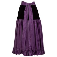 The 1976 Russian Collection is perhaps one of Yves Saint Laurent’s most renowned collections. Drawing international inspiration from the traditional Russian and Balkan cultures, YSL constructed an unforgettable display of color, drama, and globalism through his reimagined designs. Hailing from that collection, this ankle-length skirt is done in a regal purple silk taffeta. The waist of the skirt is formed with a sash that moves into a yoke made from luxurious black velvet. Attached, the taffeta 1970s Skirt, Couture Skirts, Full Maxi Skirt, Silk Maxi Skirt, Peasant Skirt, Skirt Purple, Vintage Ysl, Ankle Length Skirt, Gibson Girl