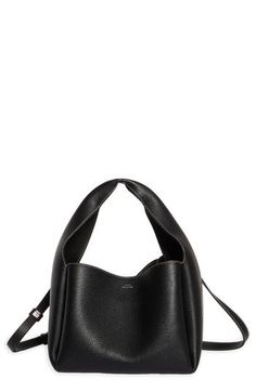 Sculpted from grained leather in a cube silhouette, this bucket bag offers plenty of room for the everyday essentials while retaining a lightweight feel. Carry the versatile look by the folded handle or attach the adjustable strap for shoulder wear. Bridge-clip closure Top carry handle; removable, adjustable shoulder strap Interior wall pocket; card slot Leather Made in Italy Designer Handbags Versatile Bucket Bag In Textured Leather, Versatile Textured Leather Bucket Bag, Textured Leather Satchel Bucket Bag For Work, Textured Leather Shoulder Bucket Bag For Work, Everyday Textured Leather Bucket Bag, Everyday Textured Leather Bucket Hobo Bag, Chic Pebbled Leather Bucket Bag For Everyday, Modern Textured Leather Bucket Hobo Bag, Chic Everyday Bucket Bag In Pebbled Leather