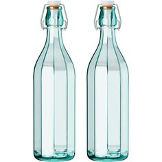 two empty glass bottles sitting next to each other on a white background, one is green and the other is blue