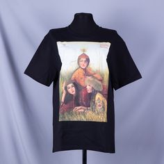 The black T-shirt with an original print by Nurila Medetbek is not just clothing; it is art embodied in fabric. This women's oversized T-shirt with a round neckline is made of 100% cotton, ensuring maximum comfort and a pleasant feel on the skin. The print on the T-shirt is not only a visual delight but also a profound symbol of respect for traditions. Nurila Medetbek, continuing family traditions in art, infuses this T-shirt with a special energy inspired by the national heritage of Kazakhstan. Each element of the print intertwines modern design with the richness of Kazakh culture. This T-shirt is perfect for those who appreciate uniqueness and want to stand out from the crowd. It is an excellent choice for both everyday wear and special occasions when you want to emphasize your individua Artistic Printed Black Top, Artistic Black Printed Top, Artistic Black T-shirt For Summer, Artistic Black Summer T-shirt, Traditional Printed Black Tops, Traditional Black Printed Top, Traditional Short Sleeve T-shirt With Graphic Print, Black Cotton T-shirt With Digital Print, Traditional Black Crew Neck Top