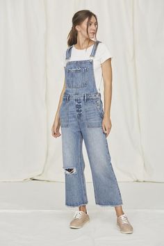 Pair with a cute jean jacket from a trendy denim on denim look. Denim Wide Leg Cropped Overall Distressed Detail Raw Hem Medium Wash Cotton Trendy Overalls With Frayed Hem For Spring, Trendy Spring Overalls With Frayed Hem, Medium Wash Denim Jumpsuit With Frayed Hem, Relaxed Fit Everyday Overalls And Jumpsuits, Relaxed Fit Everyday Overalls And Rompers, Relaxed Fit Everyday Jumpsuits And Rompers, Everyday Relaxed Fit Overalls, Cotton Overalls With Frayed Hem, Medium Wash Relaxed Fit Denim Jumpsuit With Bib Front