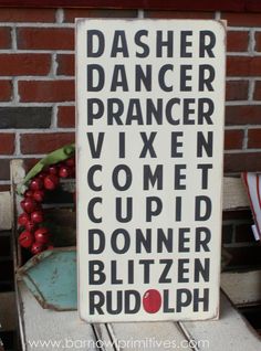 a wooden sign that says dasher dancer, vixen cometd, donner bitzer rudolph