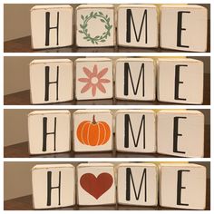 four blocks spelling home with pumpkins and flowers