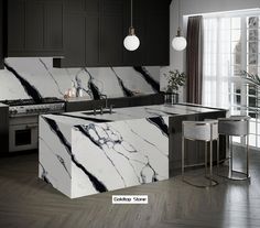 a kitchen with black and white marble counter tops