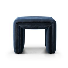 an upholstered stool made out of black leather with a square shaped foot rest