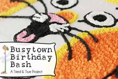 a close up of a cake with a cat on it's face and the words bushtown birthday bash