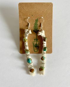 These Earrings are handmade and ethically sourced. They are crafted with wire and brought together with different stones and crystals onto a perfectly natural bone. These Earrings will make any outfit stand out! They are about 3.80, 4 or 4.75 inches long and dangle away from your shoulder with beautiful stones. Even though they might look heavy they are not with weighing only 8 or 15 grams depending on the size! The bones are from a fawn who passed away on our property, they were then collected Bone Crafts Earrings, Deer Bone Jewelry, Animal Bone Jewelry Clay, Diy Bone Jewelry, Bone Earrings Handmade, Bohemian Hand-wrapped Dangle Earrings, Bohemian Hand Wrapped Dangle Earrings, Bohemian Wire Wrapped Adjustable Wrap Earrings, Adjustable Hand Wrapped Dangle Earrings