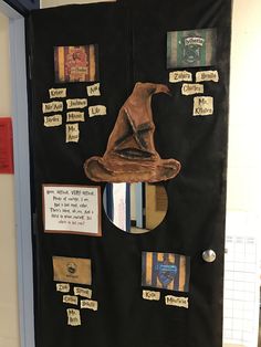 a door decorated with harry potter's hat and hogwarts related to the book