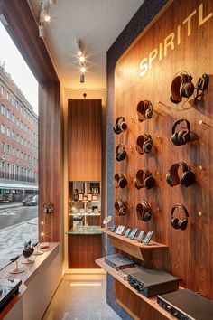 a store with wooden walls and shelves filled with pots, pans and other items