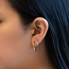 Elevate your style with this sculptural melted small hoop earrings. Designed to feel lightweight on your ears. Hypoallergenic, lead and nickel free Height 20mm (0.8in) x Width 3mm (0.12in) Latch, Click to close E460-G Trendy Everyday Huggie Earrings With Ear Wire, Trendy Everyday Huggie Earrings, Trendy Everyday Pierced Wrap Earrings, Modern Small Hoop Cartilage Earrings Tarnish Resistant, Modern Pierced Huggie Earrings, Trendy Small Hoop Huggie Earrings, Modern Metal Huggie Earrings For Everyday, Metal Huggie Earrings For Everyday, Minimalist Metal Hoop Earrings For Everyday