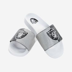 These Las Vegas Raiders Women's Big Logo Shimmer Slides are the jewel of fresh fan footwear! Let your team spirit shine like a beacon of awesome! Features Team-colored design with team logo display on strap, in case there were any doubts where your allegiances lie Shiny tiles on top of strap to make your fandom shine Miniature team logo display on heel of footbed for a little extra fandom Slip-on style with open-toe design, so you can stay cool in the heat of competition, or at the beach Details Bff Ideas, Pool Sandals, Rhinestone Slides, Sandal Slides, Mens Slide Sandals, Closed Toe Sandals, Mens Slides, Toes Designs, Las Vegas Raiders