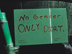 a green sign that says no gender only dirt