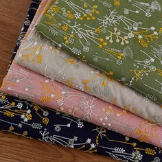 four different fabrics stacked on top of each other