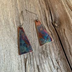 These little beauties are so easy to throw on and wear for work or play.  The multicolor pattern make them versatile to wear with so many outfits.  Each pair are a one of a kind and hang from stainless steel ear wires.  I use the heat of my torch to create each pattern and colors on each earring.  I use a protective coating to preserve their beauty.  Note: Each pair have their own unique colors and patterns. Artsy Copper Dangle Earrings, Artsy Nickel-free Copper Earrings, Brown Artsy Earrings, Artsy Pierced Copper Earrings, Artsy Copper Earrings For Pierced Ears, Multicolor Copper Jewelry For Gifts, Multicolor Copper Jewelry For Gift, Multicolor Copper Jewelry Gift, Handmade Rainbow Earrings For Everyday