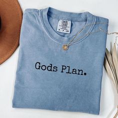 Gods Plan spell out unisex Comfort Colors graphic T-Shirt 100% cotton comes in all sorts of beautiful colors in all sizes perfect shirt for all things good vibes, peace, love, happiness, friends, family, gifts, summer, minimalist, and God Gods Favorite Shirt, Inspirational Short Sleeve T-shirt For Summer, Inspirational Graphic Print T-shirt For Summer, Inspirational Cotton Crew Neck T-shirt, Inspirational Crew Neck Summer Top, Inspirational Cotton Tops For Summer, Inspirational Short Sleeve Summer T-shirt, Inspirational Cotton Summer Tops, Soft-washed Ring-spun Cotton T-shirt For Summer