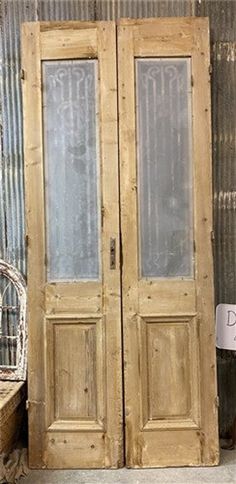 two wooden doors sitting next to each other