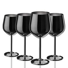 four black wine glasses lined up in a row